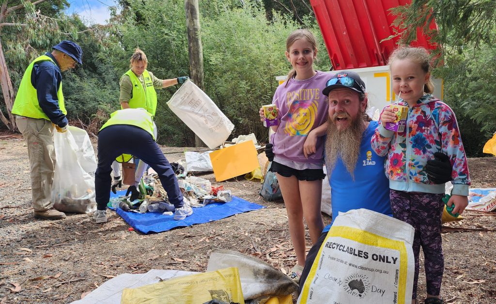 Group cleaning up litter in a park.